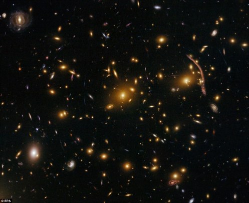 Gravitational Lensing in Galaxy Cluster Abell 370: The Hubble Space Telescope's ACS has peered nearly 5 billion light-years away to reveal intricate details in this galaxy cluster 